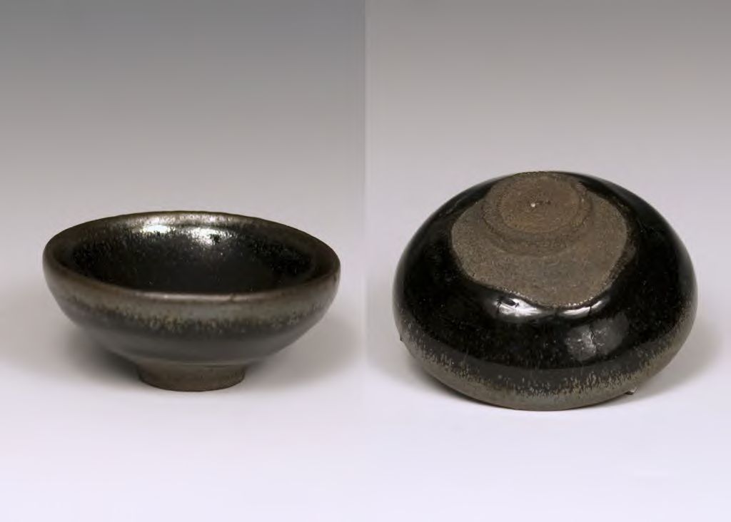 Small dark ceramic cup of bitter black coffee with no sugar, plain setting, respectful solemn mood, traditional Puerto Rican home