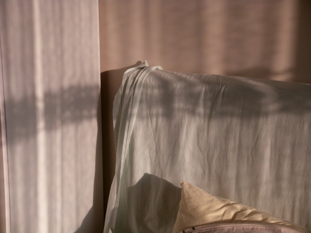 peaceful bedroom morning sunlight through curtains tranquil