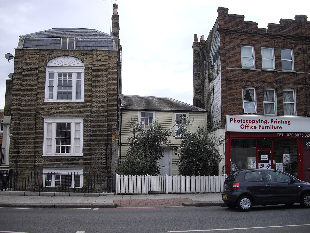 Detail view of wooden-framed cafe criollo cloth filter showing construction and stained brewing cloth
