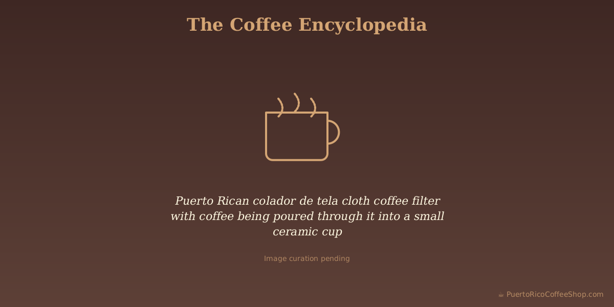 Puerto Rican colador de tela cloth coffee filter with coffee being poured through it into a small ceramic cup