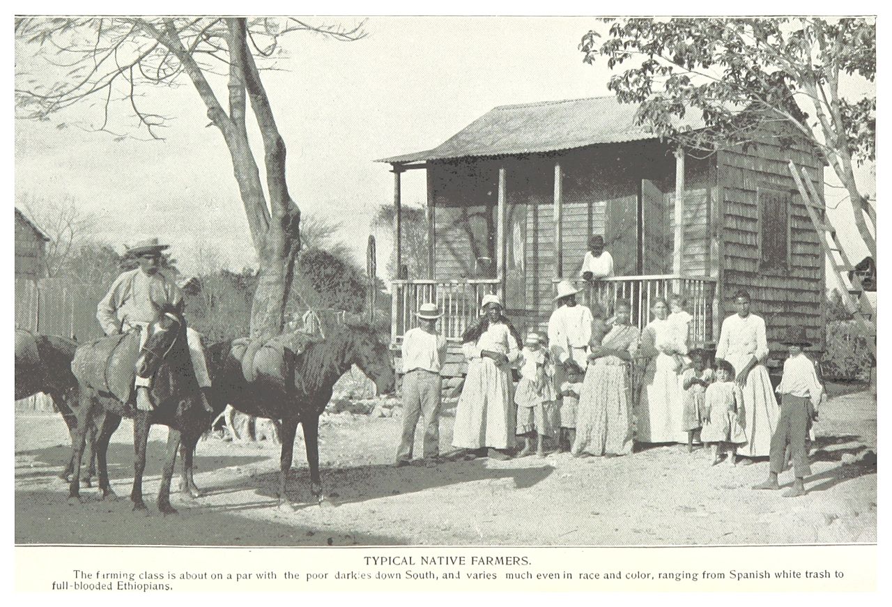 Government agricultural representative distributing cost-share program checks to Puerto Rican farmers (Wikimedia: Typical native farmers.jpg, Public domain)