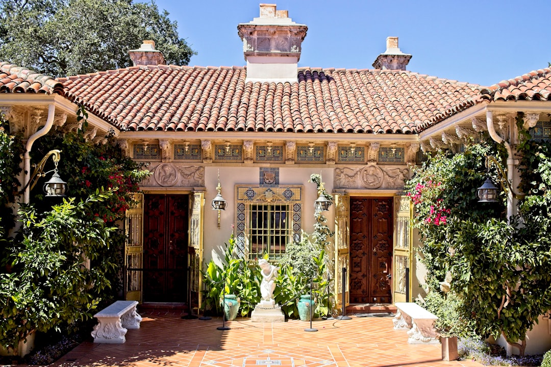 vintage-style image of Hacienda Alto Grande estate building in the mountains of Lares, traditional 19th-century Puerto Rican hacienda architecture, surrounded by terraced coffee fields under shade trees
