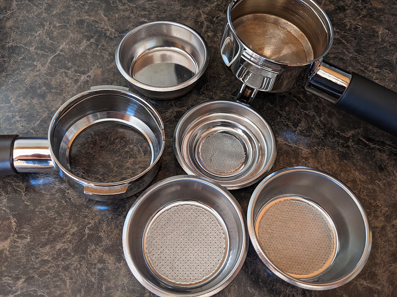 portafilter basket coffee grounds tamped espresso preparation