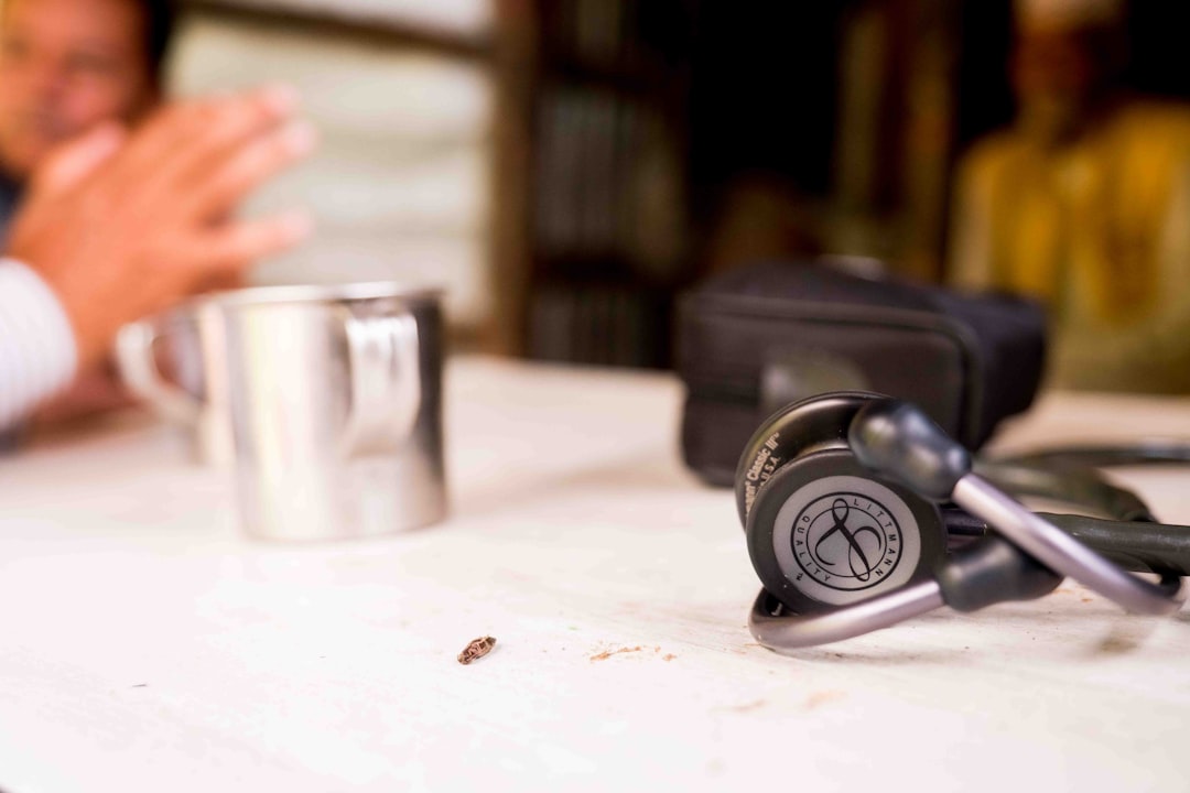 stethoscope with red coffee mug medical health concept