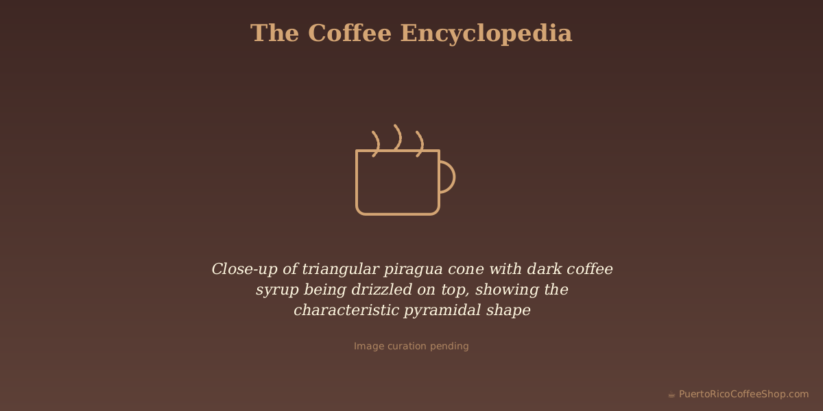 Close-up of triangular piragua cone with dark coffee syrup being drizzled on top, showing the characteristic pyramidal shape
