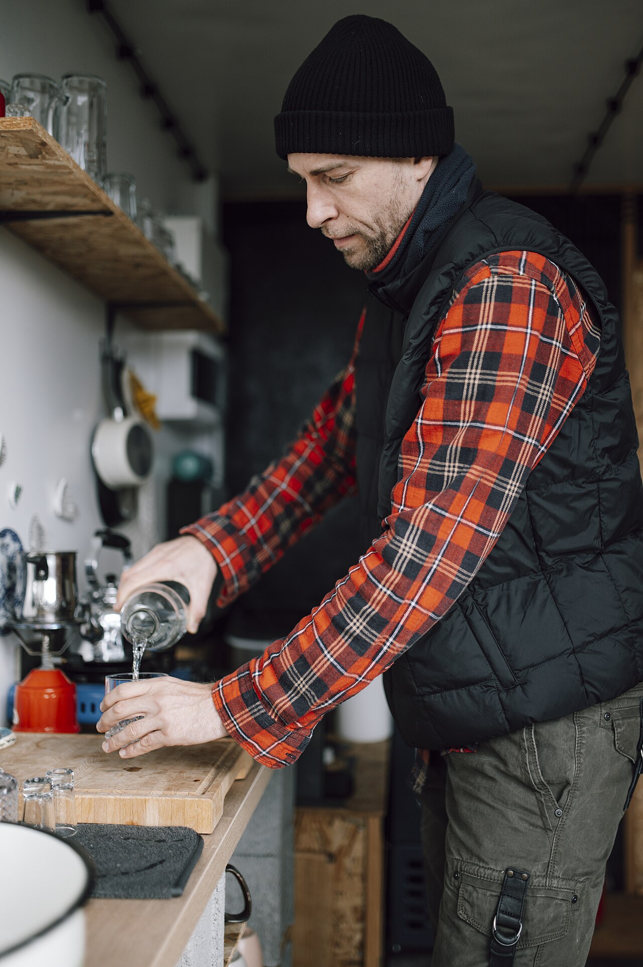 Modern Puerto Rican barista preparing specialty coffee alongside traditional recipes