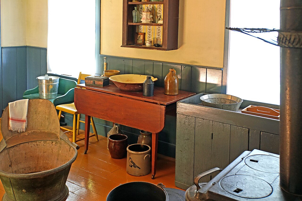 Puerto Rican family gathered around a kitchen table with traditional café con leche cups