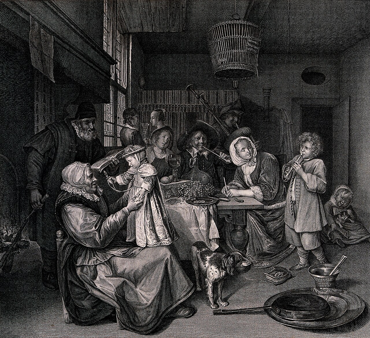 Puerto Rican family at a table after dinner with coffee cups and conversation in progress