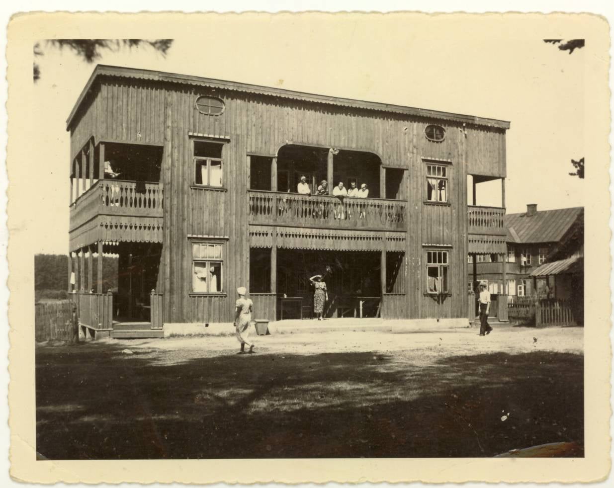 Two-story wooden coffee processing mill at Hacienda Buena Vista with restored machinery visible