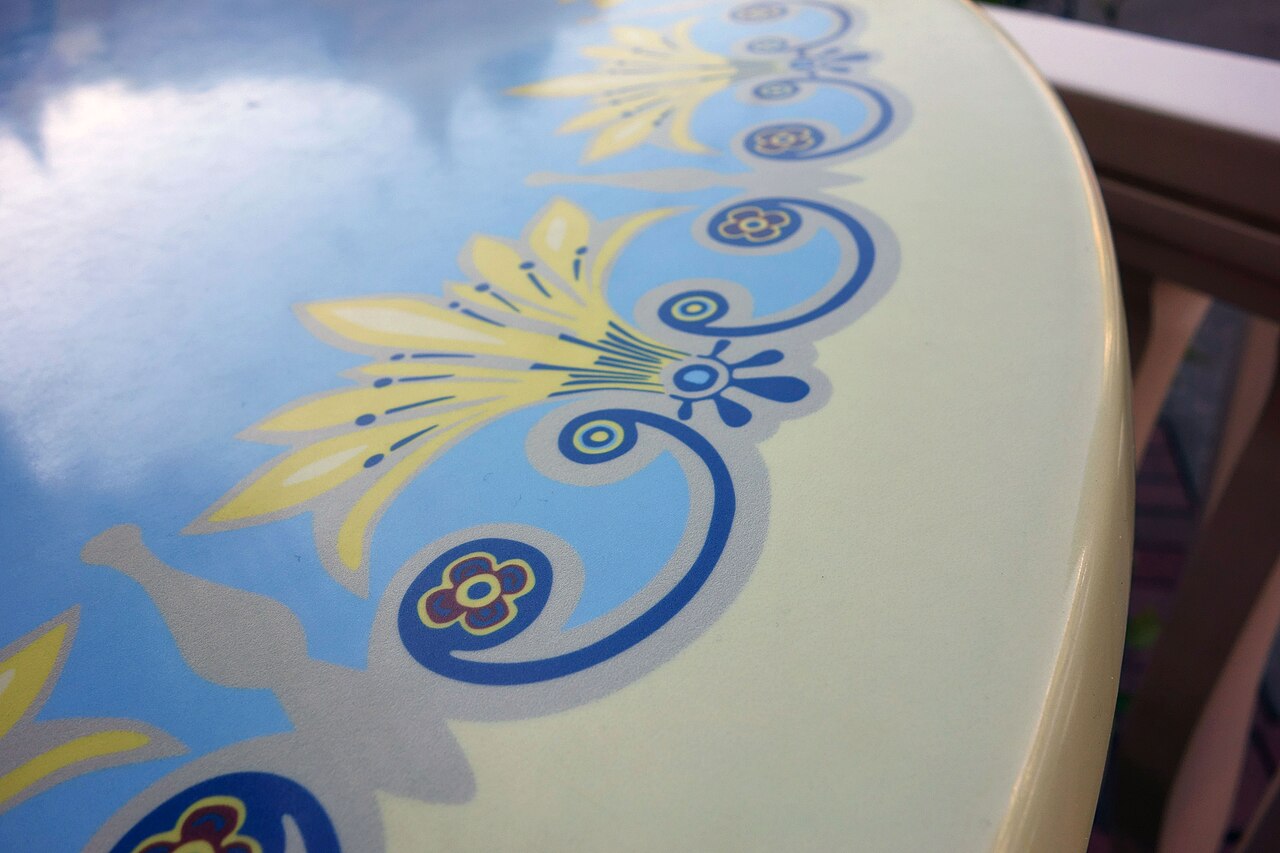 Puerto Rican holiday table with tembleque, flan, and other traditional desserts, family gathered, festive atmosphere