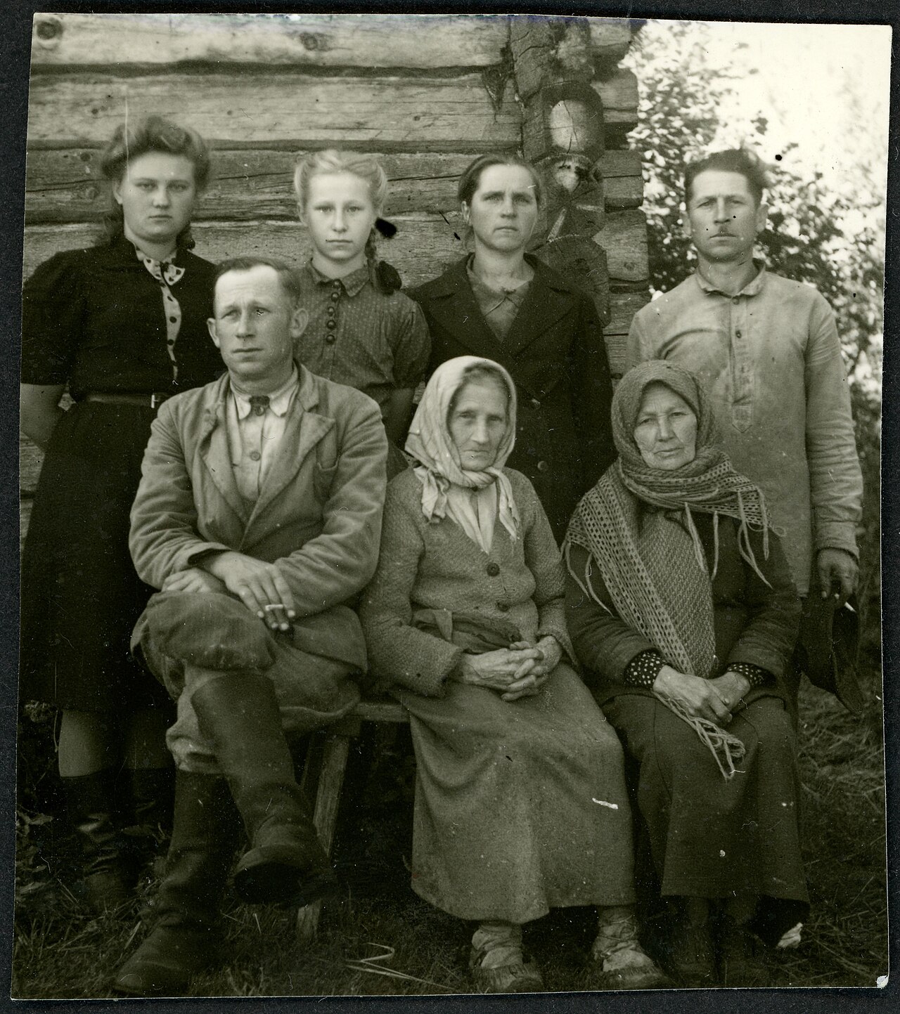 Three generations of Puerto Rican family enjoying coffee together showing cultural continuity
