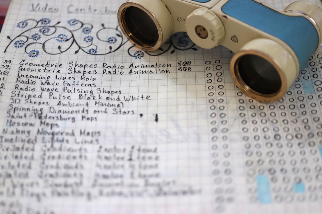 students with notebooks and binoculars participating in an educational program in a Puerto Rican mountain forest, Casa Pueblo guide pointing out plants