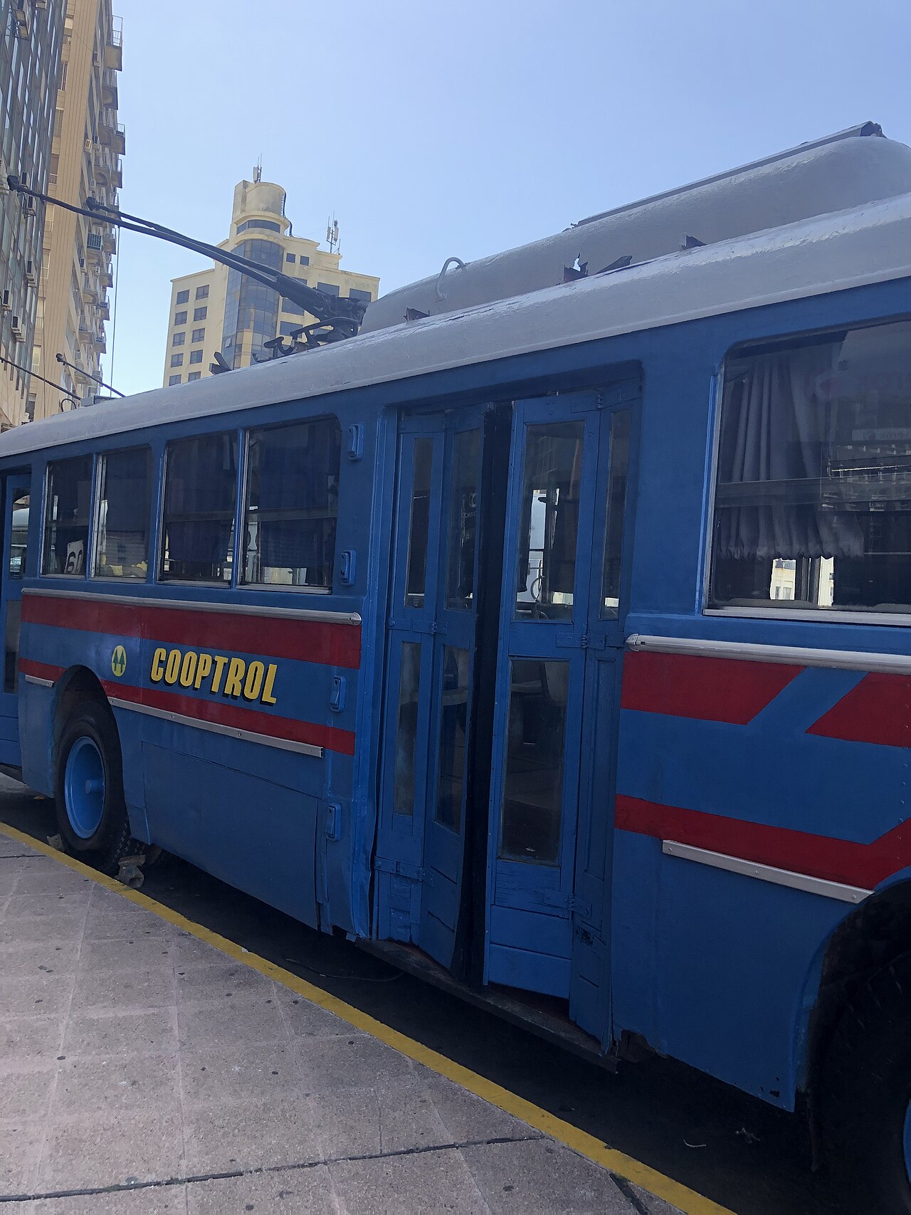 Historical photograph of Cooperativa de Cafeteros processing facility in mid-20th century Puerto Rico (Wikimedia: Ansaldo Trolleybus in Montevideo.jpg, CC BY-SA 4.0)