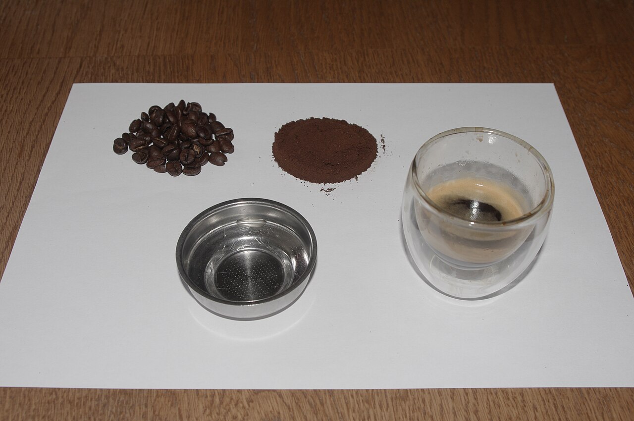 Espresso shot pouring golden crema