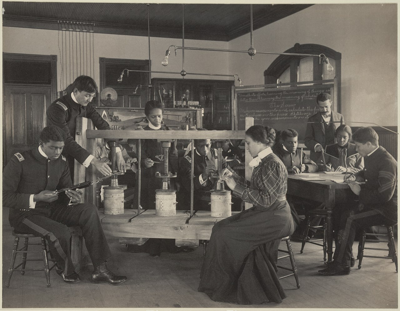 Agricultural sciences students in a classroom at UPR Mayagüez studying coffee-related curriculum (Wikimedia: The cheese press screw - students studying agricultural sciences, Hampton Instit, Public domain)