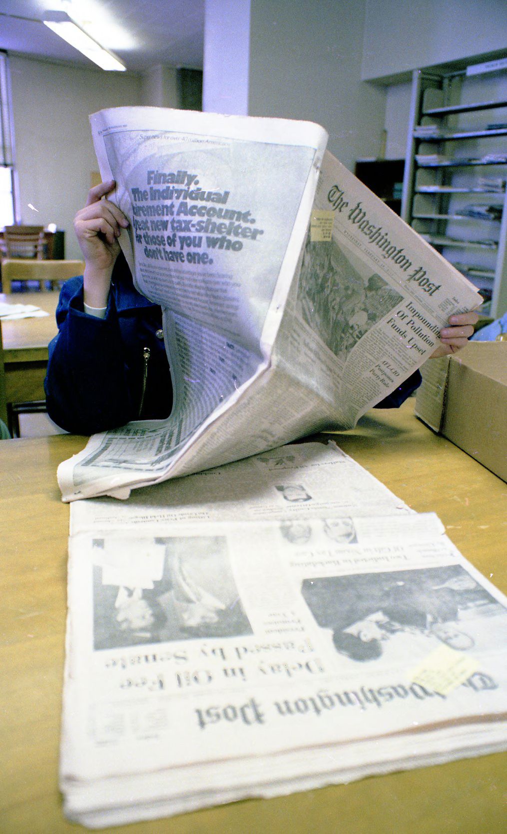 Coffee variety research plots at the Adjuntas Agricultural Experimental Station (Wikimedia: Student using newspapers and microfilm for research - DPLA - b4a76ae31b35e556c5f, Public domain)