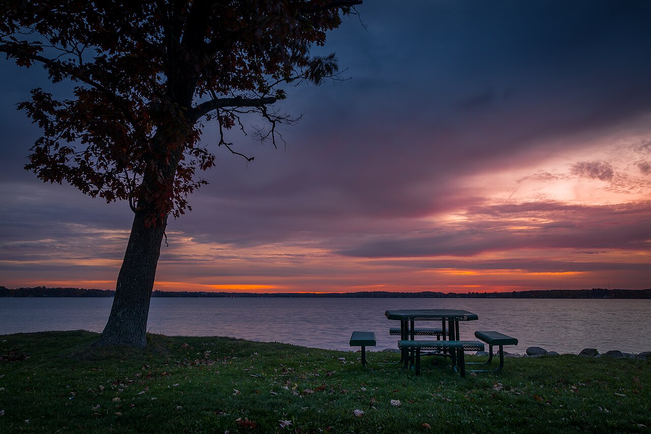 Multi-generational Puerto Rican family around breakfast table with coffee, pan, and mallorcas, warm domestic scene
