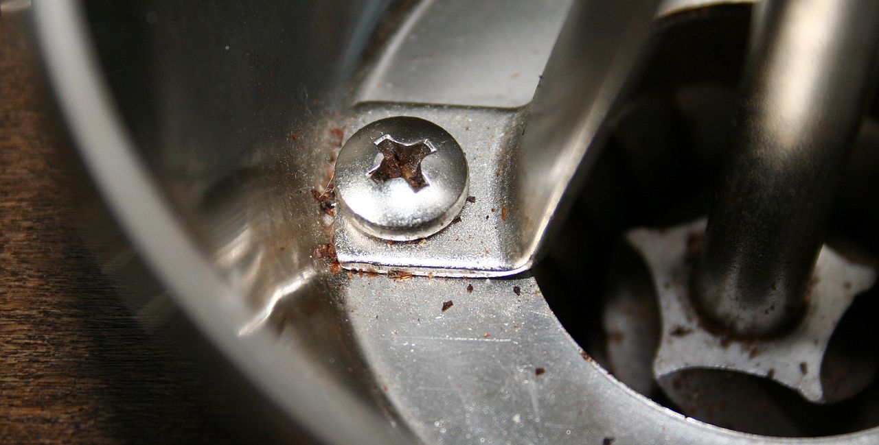 manual hand coffee grinder vintage style on rustic wooden table