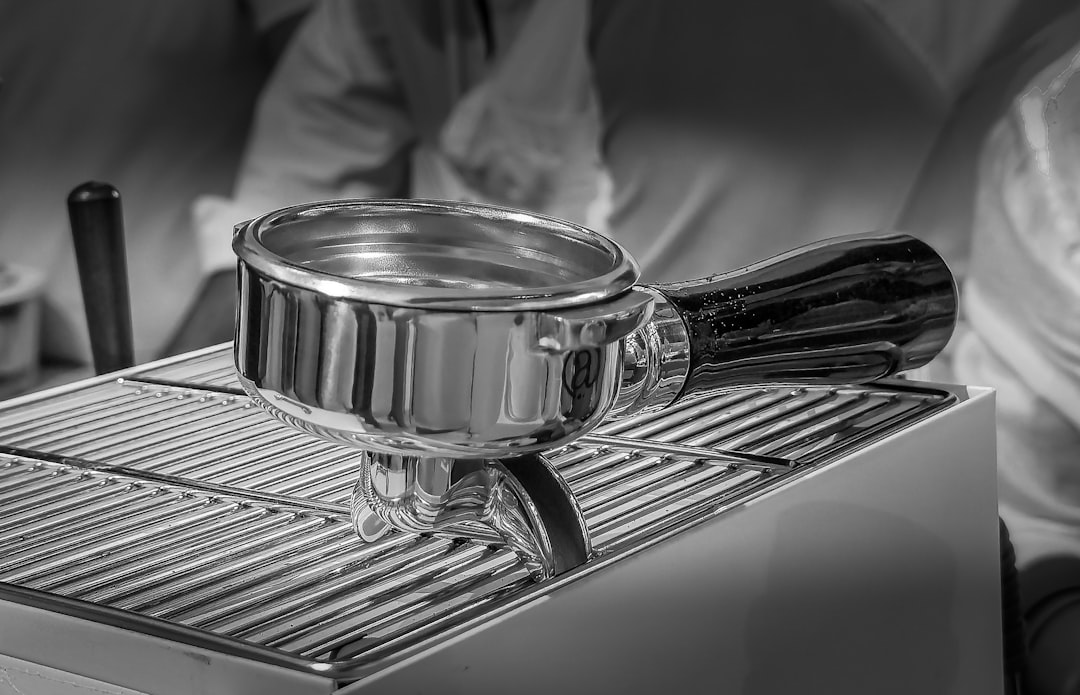 chrome espresso machine with portafilter and crema fresh shot