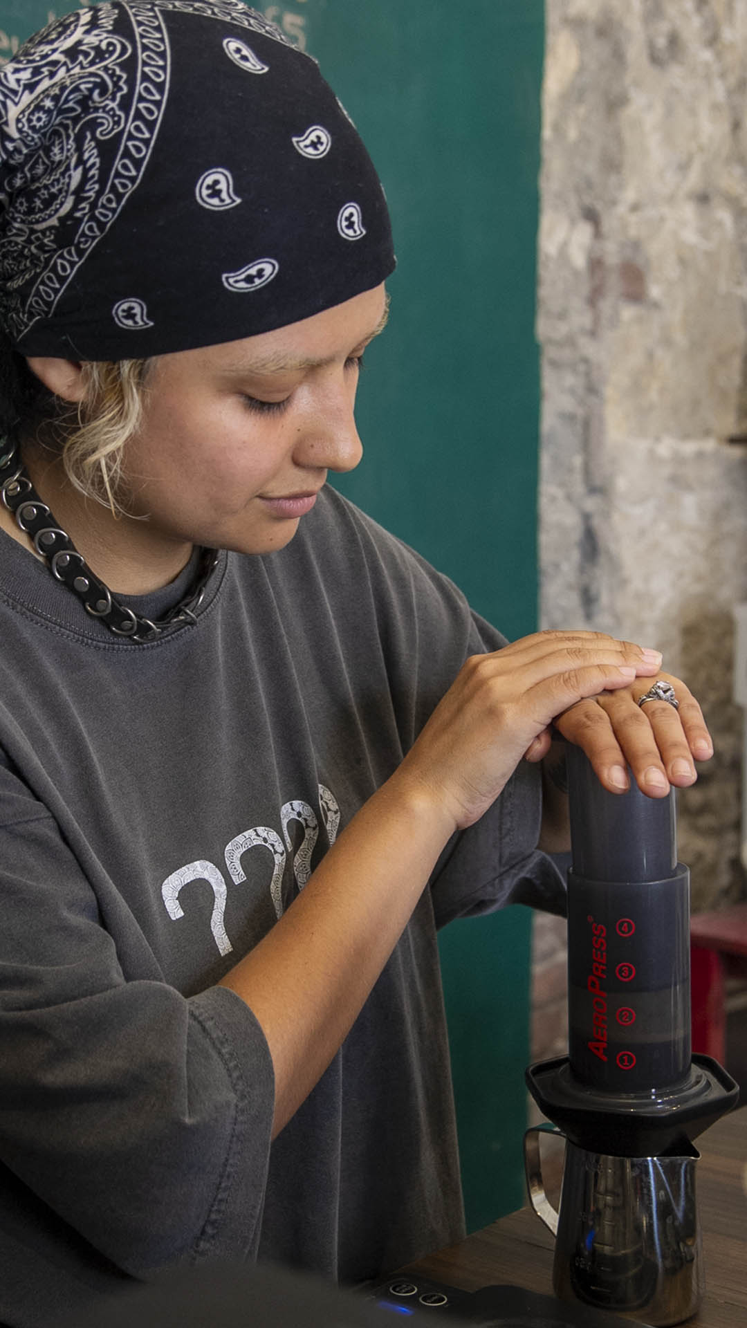 aeropress plunger pressing coffee close-up