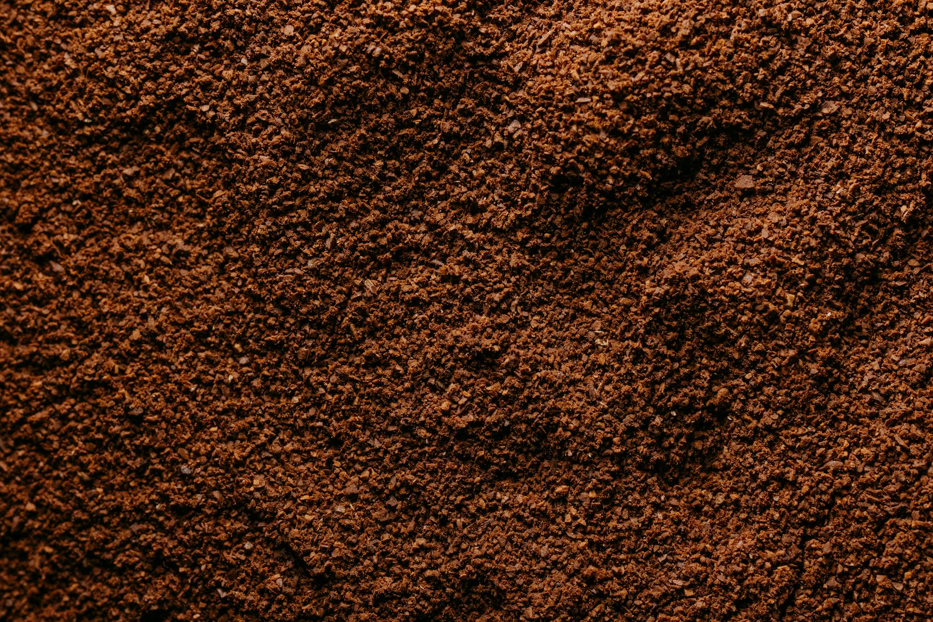 ground coffee particles uniform texture macro close-up