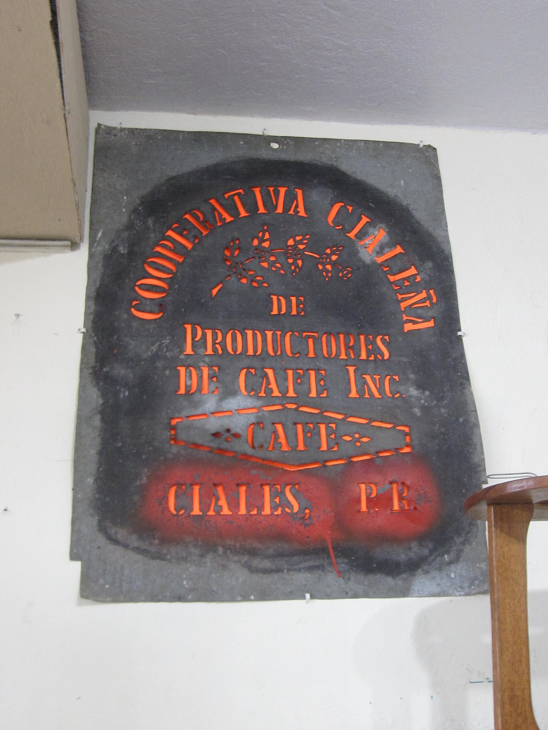 A stencil plate for marking coffee sacks, reading Cooperativa Cialeña de Productores de Café, Ciales, Puerto Rico — Museo del Café