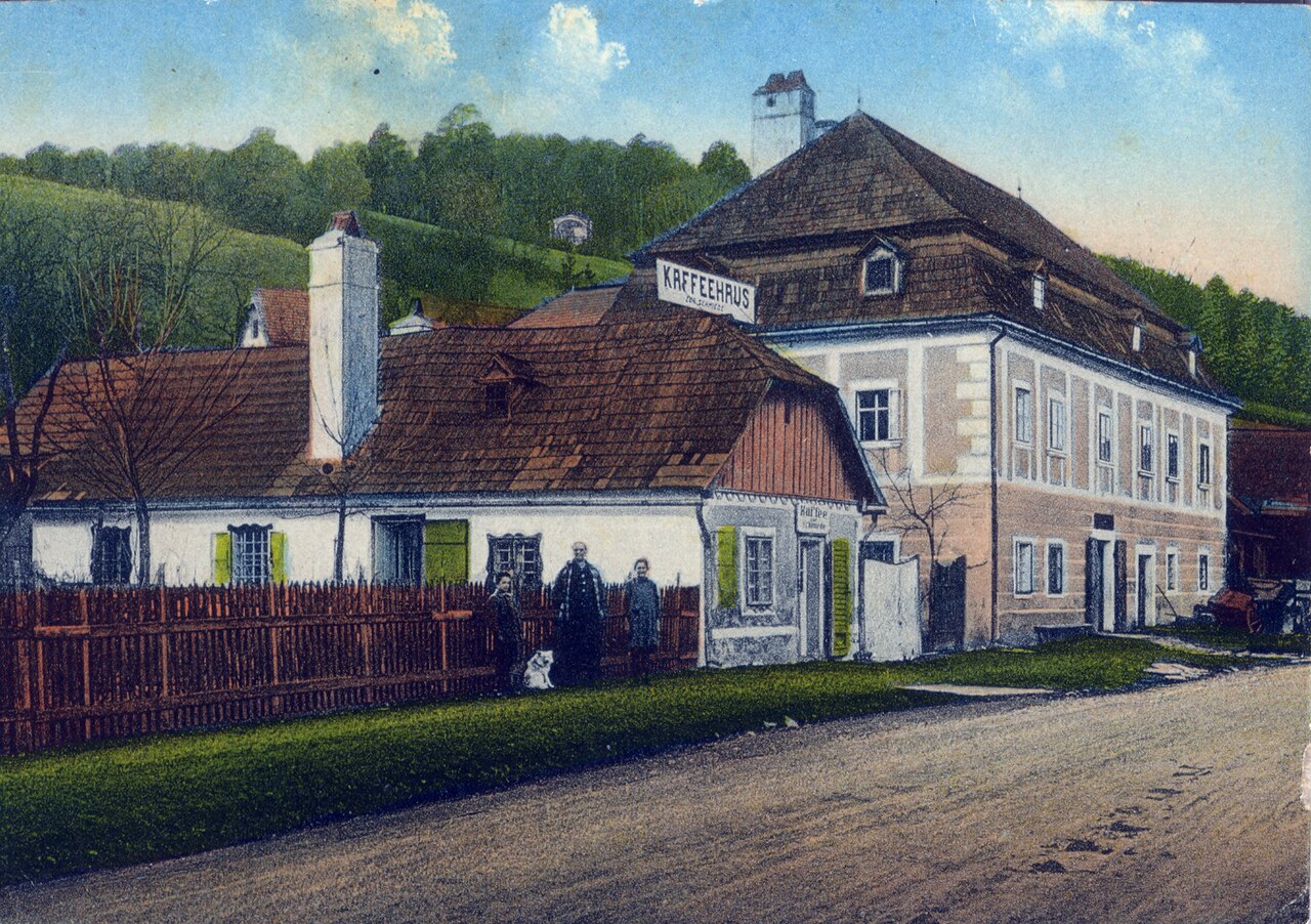 A European coffee house photographed around 1900, from a period postcard
