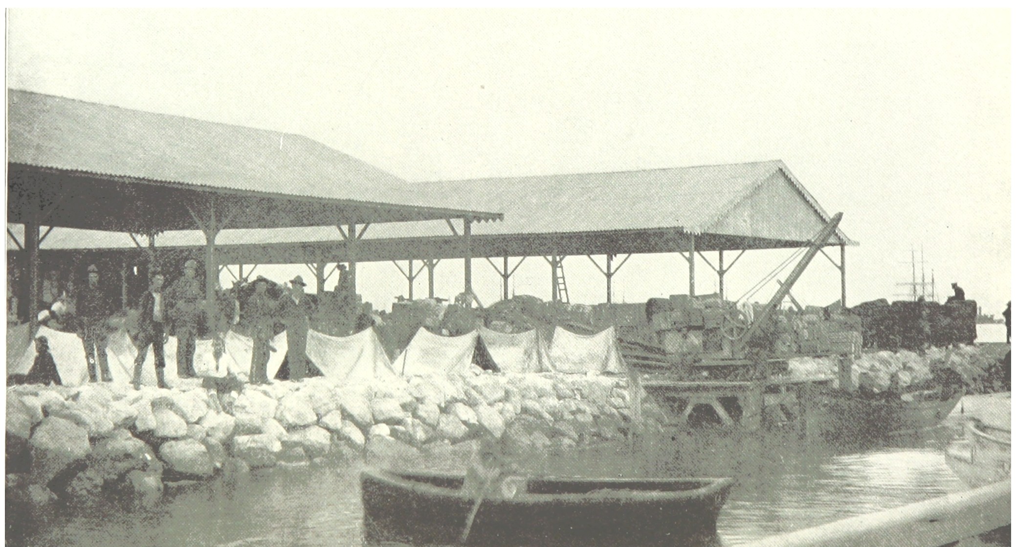 Cargo sheds, lighters and freight on a Puerto Rican wharf, 1899