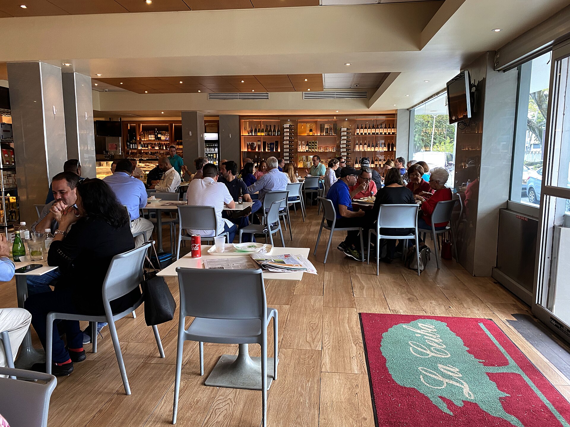 Customers over coffee at Panadería La Ceiba, Puerto Nuevo, San Juan, Puerto Rico, February 2020